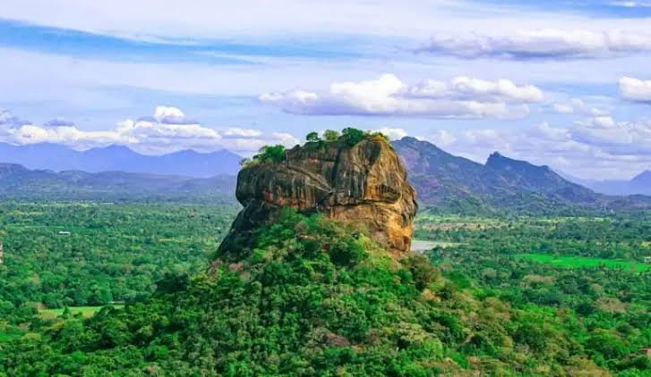 Sigiriya Rock Fortress under a blue sky